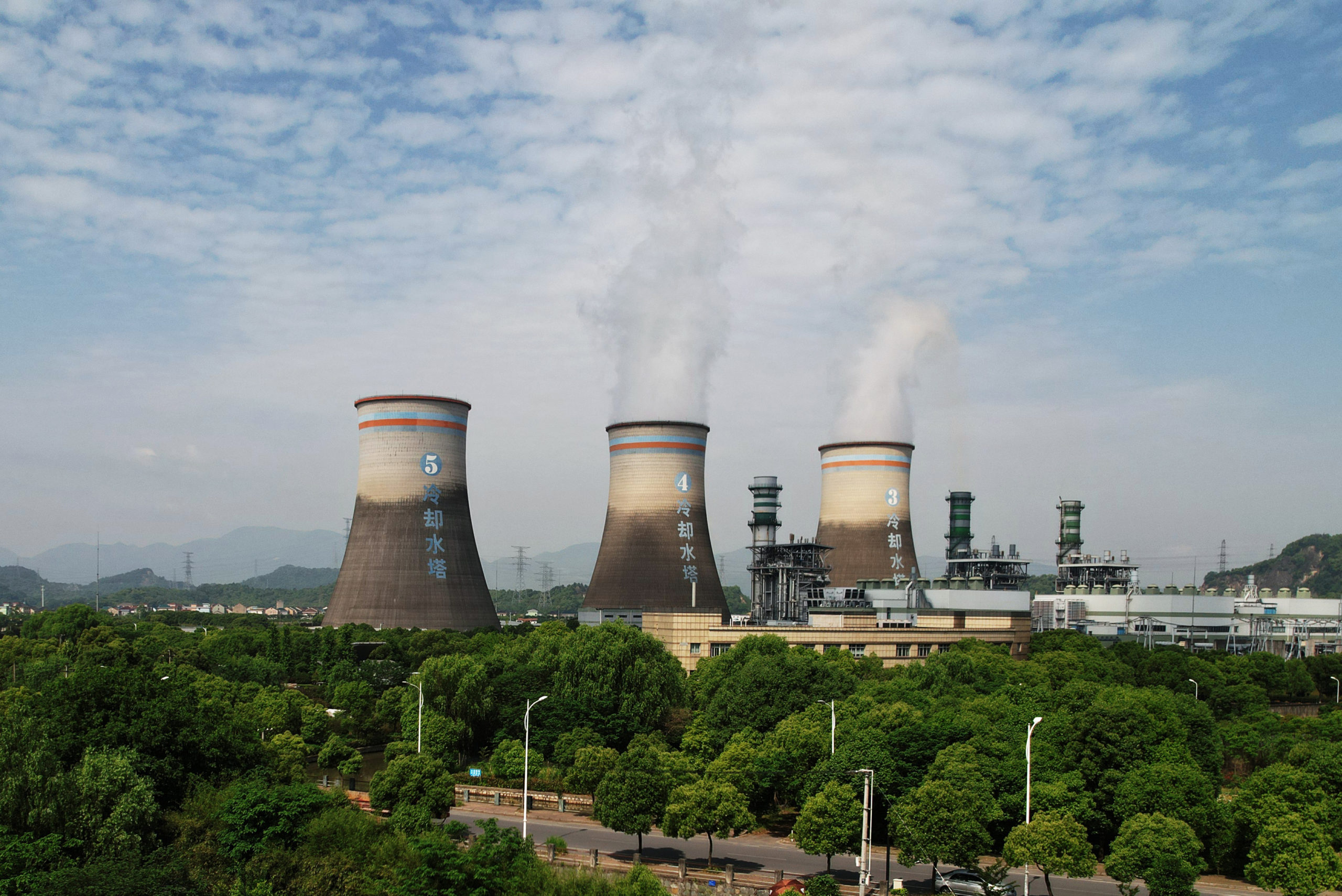 Steam billows out of chimneys of a coal-fired power plant in Hangzhou in east China's Zhejiang province on Friday, July 16, 2021. Getty Images photo