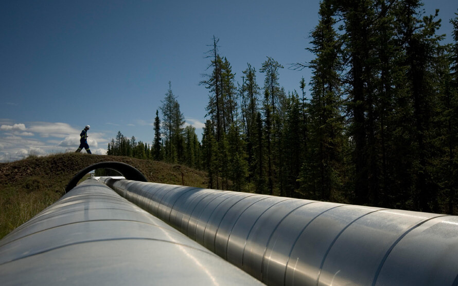 Worker on a wildlife crossing at MEG Energy's Christina Lake oil sands project. Wildlife crossings are strategically placed approximately every 400 metres over above-ground pipelines at the project. Photo courtesy MEG Energy