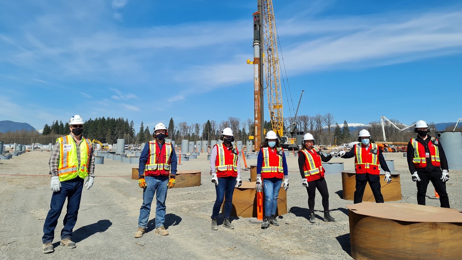 Workers in front of the last pile at the LNG Canada site in Kitimat, B.C. Photo courtesy LNG Canada