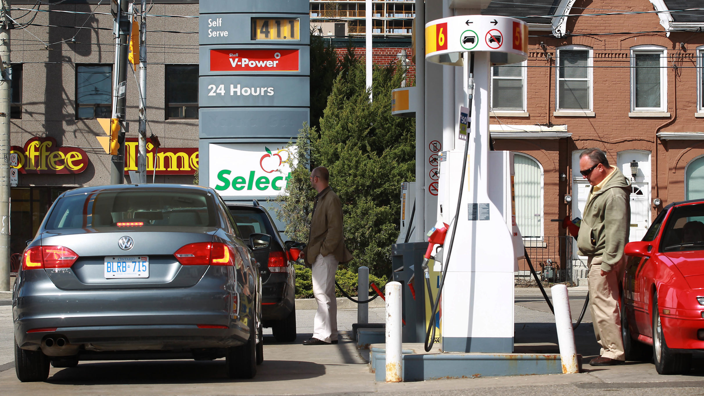 Motorists fill their vehicles at Richmond and Parliament in Toronto. Getty Images photo